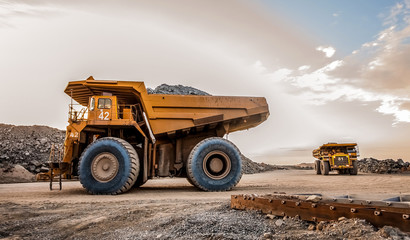 Mining dump trucks transporting Platinum ore for processing © Sunshine Seeds
