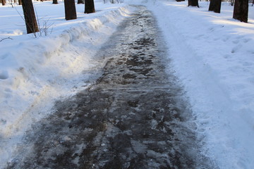 track with ice and puddles in early spring
