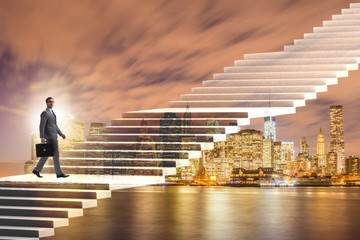 Businessman climbing career ladder over city