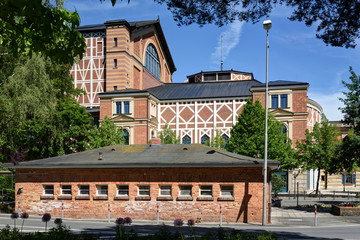 opera house of Richard Wagner in Bayreuth,Germany, named Festspielhaus, with a public building, that contains toilets, post office and a kiosk, shot from a public place