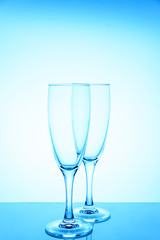 empty glasses for wine and champagne on a blue background