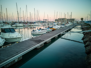 Fototapeta premium Burriana marina with boats reflected in the sea