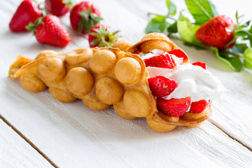 Hong Kong waffles with strawberries and whipped cream