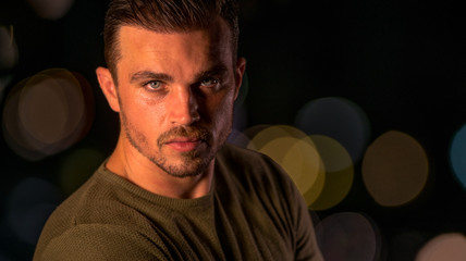 Night portrait of handsome Caucasian male model