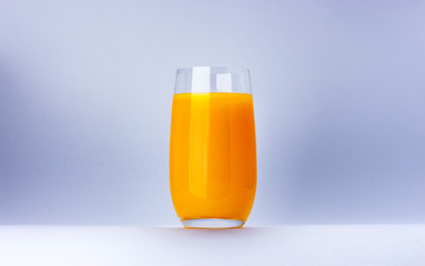 Glass of orange juice isolated on white background with copy space