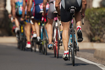 Naklejka na ściany i meble Cycling competition cyclist athletes riding a race at high speed