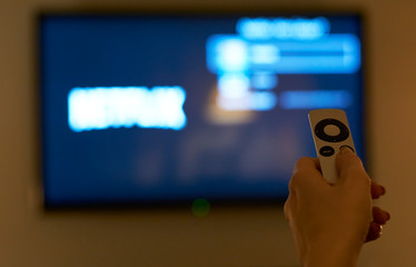 Holding hand on remote control