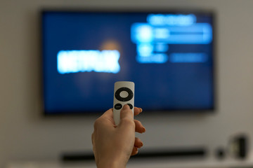 Holding hand on remote control