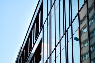 The windows of a modern building for offices. Business buildings architecture.