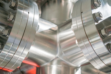 Detail of vacuum equipment with steel flanges bolted to the vessel in laboratory or industrial...