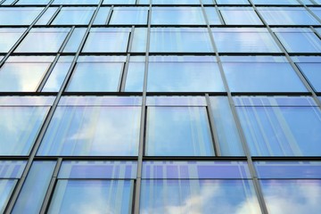 The windows of a modern building for offices. Business buildings architecture.