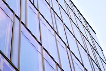 The windows of a modern building for offices. Business buildings architecture.