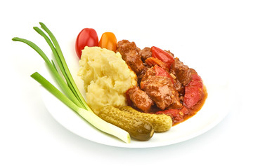 Goulash traditional homemade European beef meat stew soup, Hungarian bograch, close-up, isolated on white background