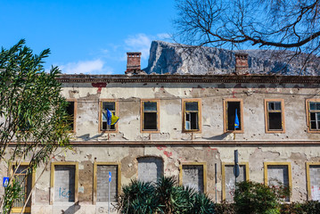Building in Mostar damaged by the war and still not renovated. Ruined by bullet holes, mortar bomb shell grenade damage