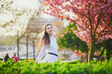 Woman enjoying cherry blossom season in Paris, France