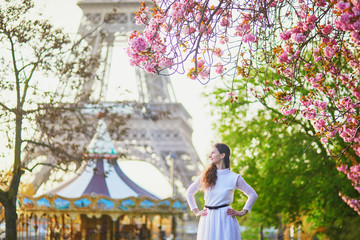 Woman enjoying cherry blossom season in Paris, France