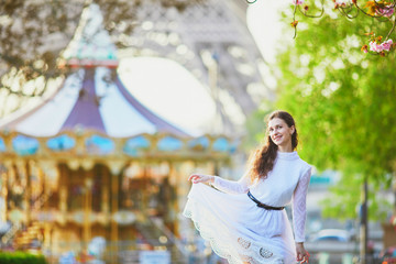 Woman enjoying cherry blossom season in Paris, France