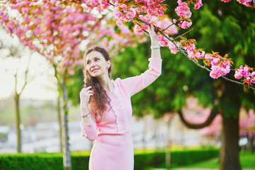 Woman enjoying cherry blossom season in Paris, France