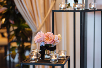 Beautiful wedding decor arch for the ceremony. Wedding photo zone at the festival with fresh flowers.