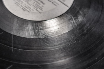 Scratches on a vinyl record. Sound track on vinyl. Old record for gramophone. Spoiled music...