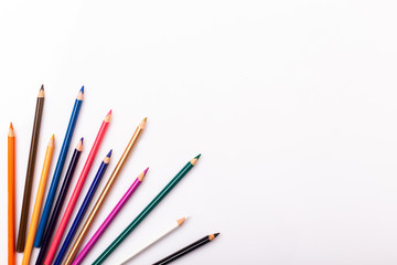 Colorful pencils pattern isolated on white background. Top view
