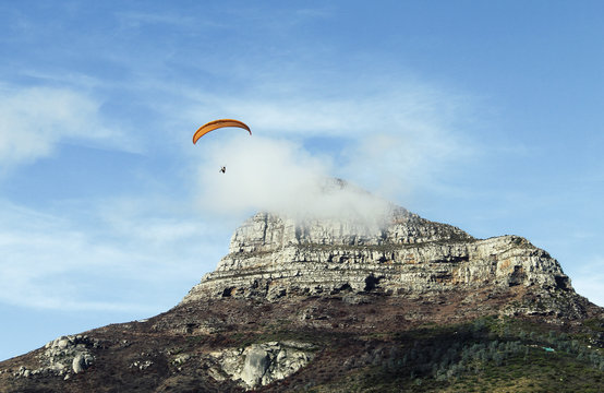 People paragliding from Lion's Head mountain in Cape Town, South Africa