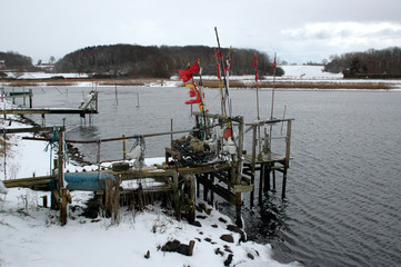Small fishing hamlet with boats, and all kinds of fishing gear in winter.
