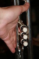 Fototapeta premium The trumpet valves on the brown background