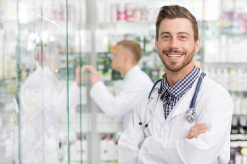 Two chemists working at the pharmacy