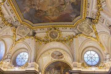 Stunningly beautiful ceiling with giant painting and gold decorative trim and classic roman style architecture