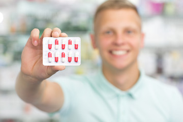 Handsome young man at the pharmacy