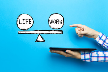 Life and work balance with a tablet computer on a blue background