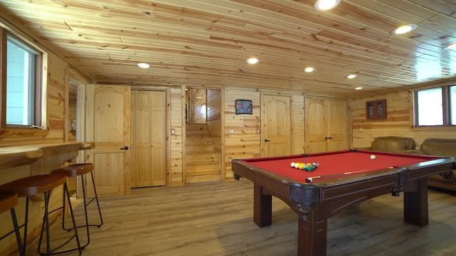 Interior of billiard room with pool table in recreation center