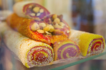 Tasty oriental sweets on a counter of shop. Food