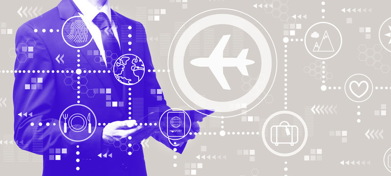 Airplane travel theme with businessman holding a tablet computer - Powered by Adobe