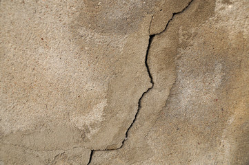 Close-up on a plastered wall. Old, cracked wall surface.