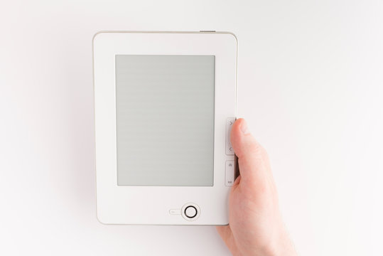 Holding E-book Reader In Hands. Book With Hands Isolated On White Background