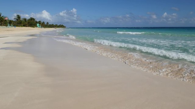 Tracking shot of gentle waves slapping against the white sandy stretch of Flamingo Beach in Culebra, Puerto Rico, with wave sounds. Flamingo is one of the most beautiful beaches in the Caribbean.