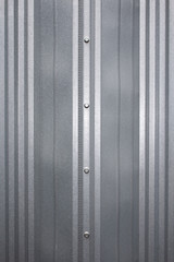 Obraz premium .Galvanized metal corrugated surface with mounting bolts