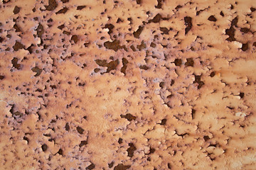 .Old rusty iron surface with falling paint