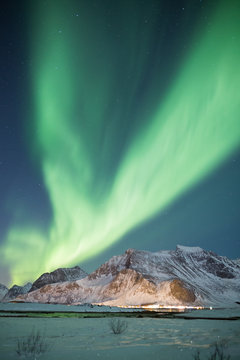 Beautiful northern light display on Lofoten islands in winter © Alexander Erdbeer