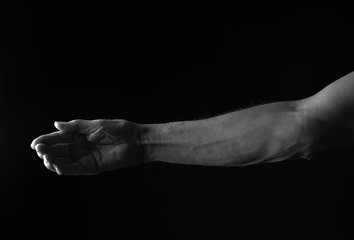 Male Hands on Black Background