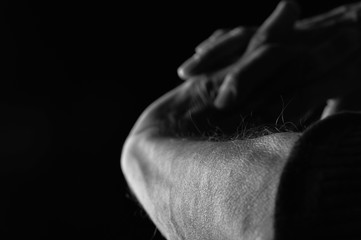 Male Hands on Black Background