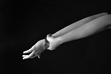 Young woman. Hands on black background