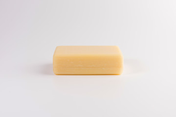 piece of beige soap isolated on a white background