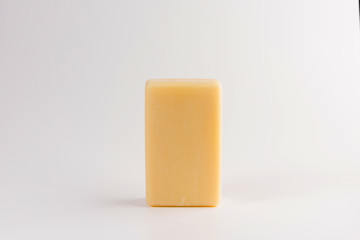 piece of beige soap isolated on a white background