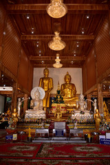 Old golden buddhist temple in Bangkok, Thailand.shrine inside of a buddhist temple.A beautiful temple with clear sky in Thailand. Temple was built in many years ago with unique Thai style