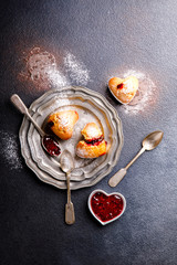 Muffins with Raspberry Jam. Sweet Home-made pastries on a dark background.Copy space for Text. Top View.