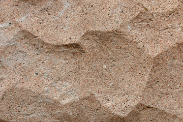 Ribbed concrete wall closeup photo. Cement surface with fluted texture.