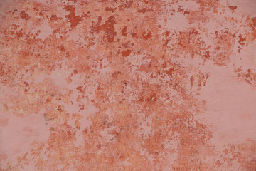 Vintage wall texture. Grunge background with pink speckled paint